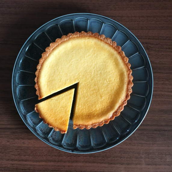 A cake made by pouring cream cheese into crunchy cookie dough and baking 