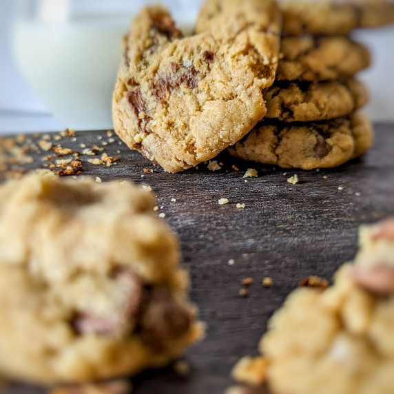 Peanut butter chocolate chip cookies with a glass of milk