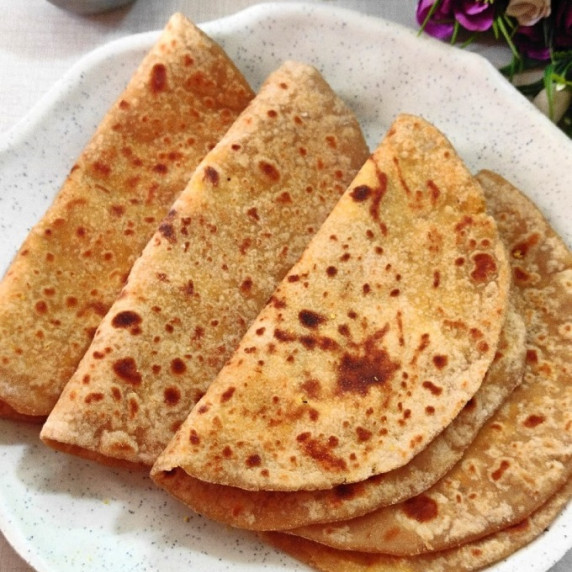 A soft & delicious sweet lentil paratha made during holi festival. This is a vegetarian dessert. 