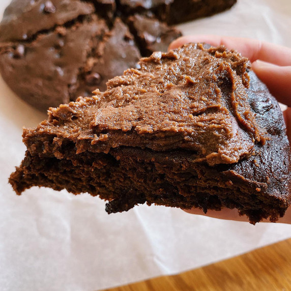 Slice of brownie with chocolate frosting 
