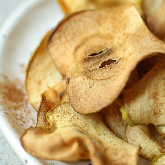 air fryer apple chips on a white plate
