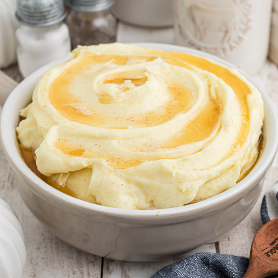 Close up of a bowl of amish mashed potatoes.