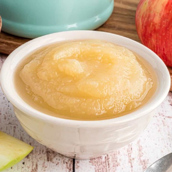 Applesauce in a white bow from the side.  