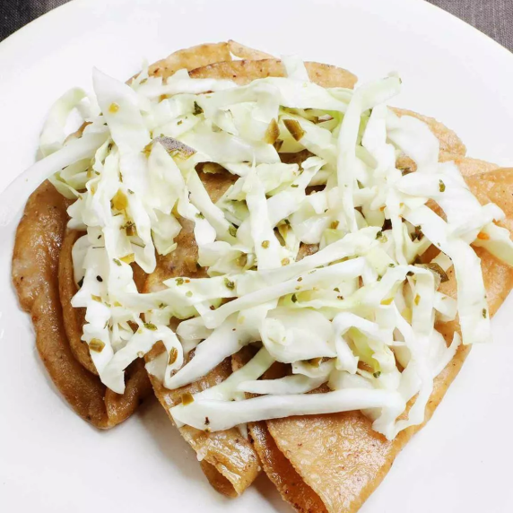 Vegetarian Tacos Made with Fresh Cheese topped with a refreshing cabbage slaw.