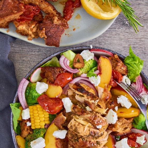 Fresh sweetcorn, juicy peaches and sun ripened tomatoes with Black Garlic Roast Chicken