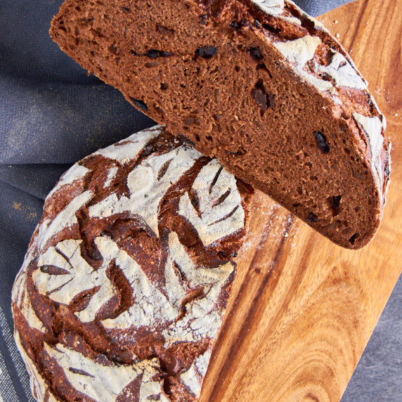 A crusty sourdough chocolate bread with black garlic pieces