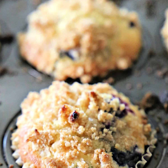 Blueberry muffins in a muffin pan.