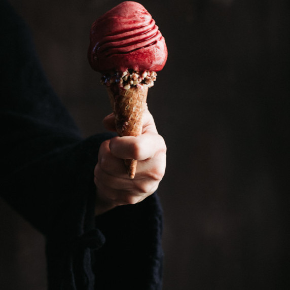 SCOOP OF CONCORD GRAPE SORBET ON AN ICE CREAM CONE