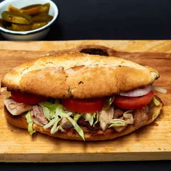 Chopped pork torta on a sandwich