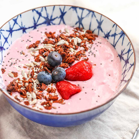 Cottage cheese smoothie bowl with fruit on top.