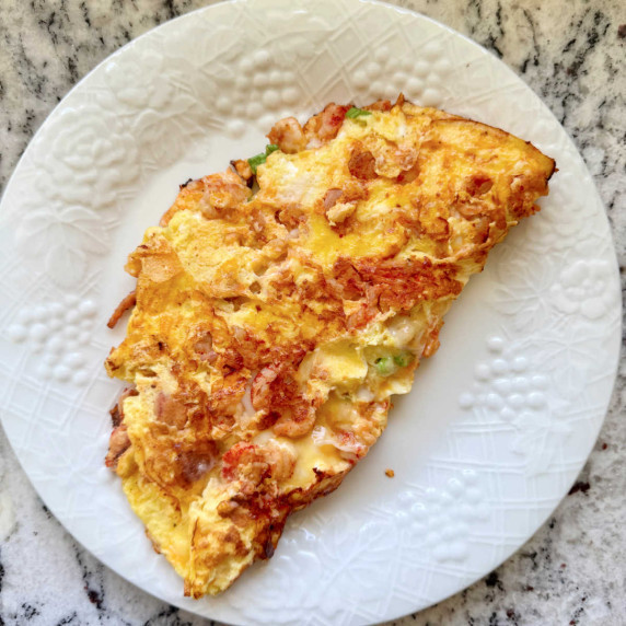 overhead close up shot of a cajun crawfish omelette.