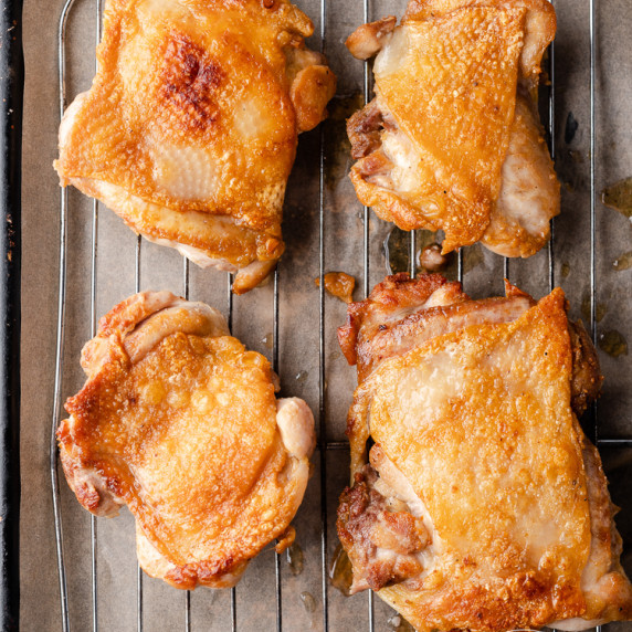 Crispy Chicken Thighs make a perfect weeknight meal! Easy to prep, easy to cook. Gluten free, low ca