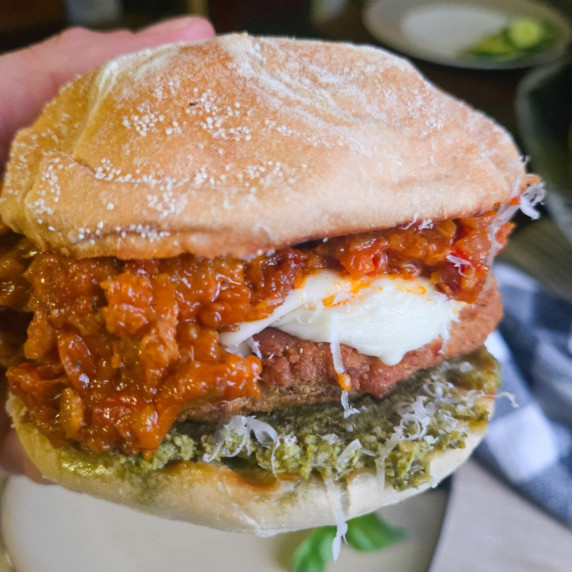 Red sauce, golden brown filet, white cheese, green pesto on a kaiser roll.