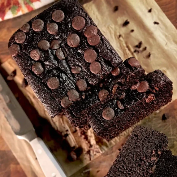 Double Chocolate Sweet Potato Bread with cut slices arranged on parchment paper