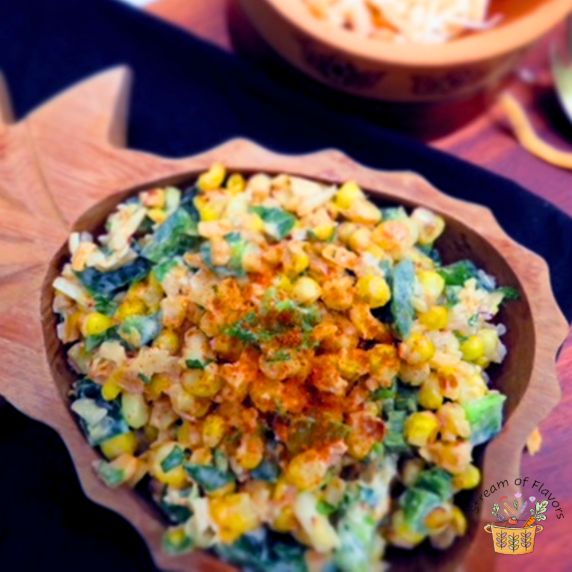 Corn kernels with cayenne, lime juice, cheese, garlic, butter, and jalapeno in a wooden bowl