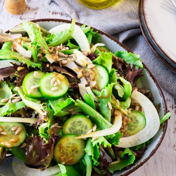 Fennel and Cucumber Salad with a Blackcurrant Vinaigrette in a Bowl.