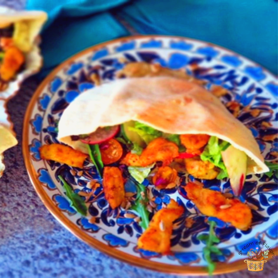 Middle Eastern Fish Shawarma with pan fried spicy fish nuggets, salad, and tarator sauce
