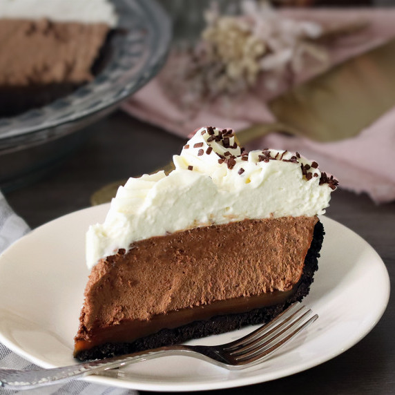 A slice of French silk pie on a white plate