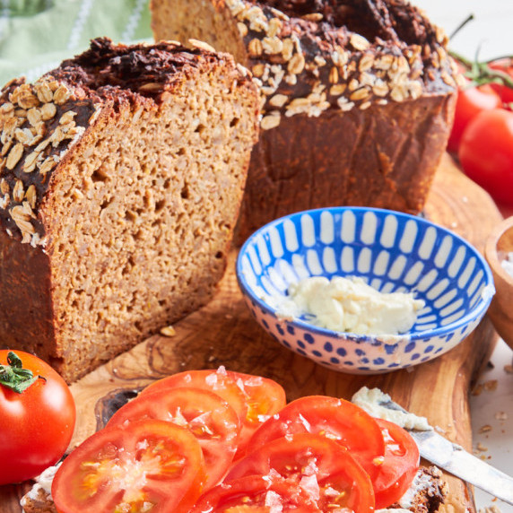German Black Bread with Protein (Sourdough Schwarzbrot) sliced open, showing the whole grains
