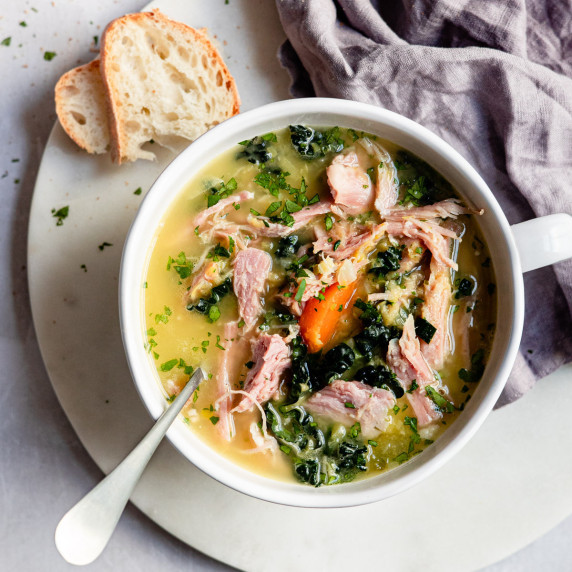 ham and lentil soup in a white bowl.