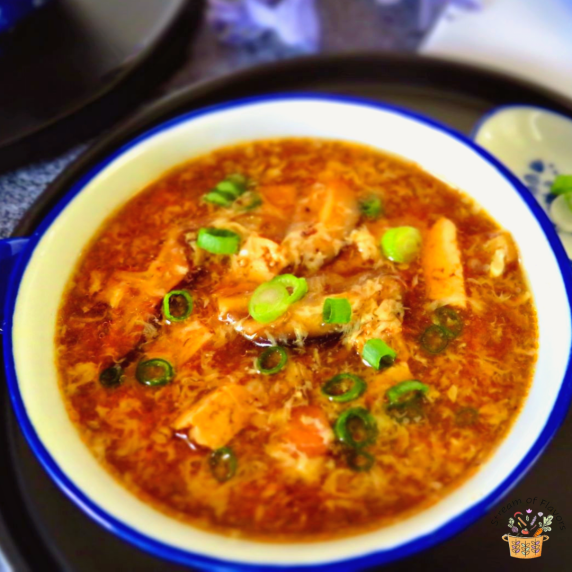 Hot and Sour Soup with mushrooms, chicken, soy sauce, tofu, and spring onions