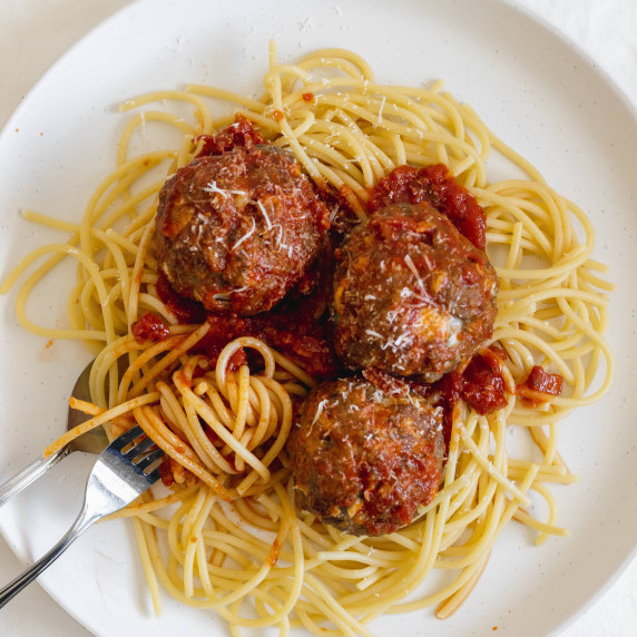 three meatballs on spaghetti 