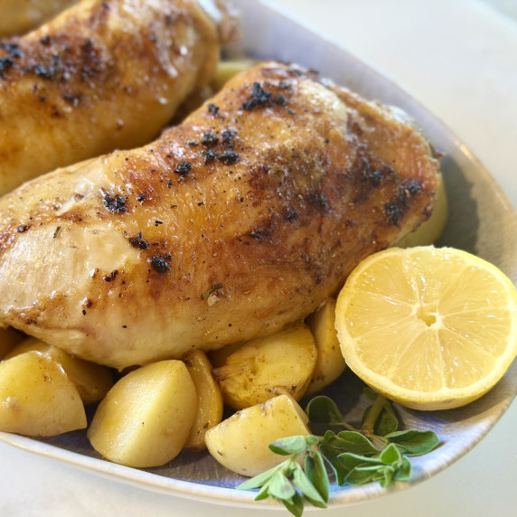 Rosemary Chicken with Potatoes and Lemon on a Platter