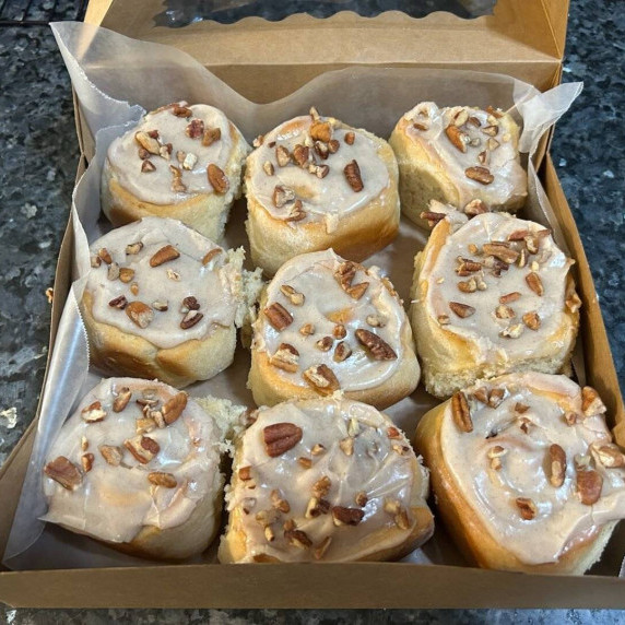 gooey pumpkin cinnamon rolls with luscious frosting and pecans