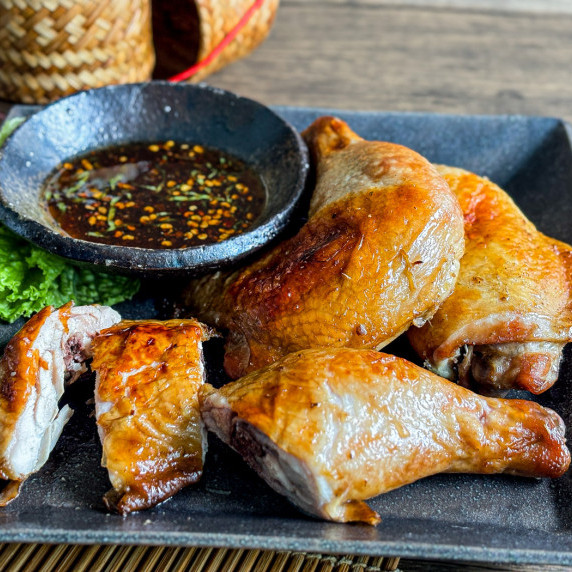 Gai yang Thai grilled chicken served with nam jim jaew sauce.