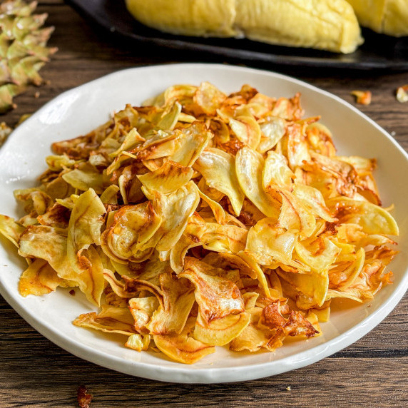 Close-up of durian chips in a white dish.