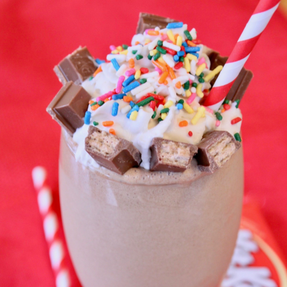 Kit Kat Coffee Chiller with a red and white stripped straw.  