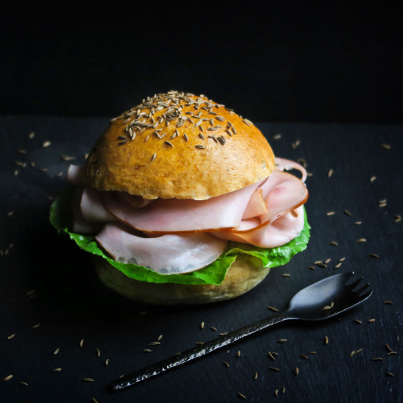 Soft and fluffy home baked caraway seed rolls 