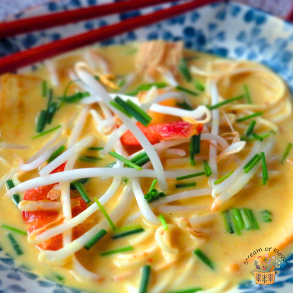 Laksa Lemak with shrimp, tofu, eggs, coconut milk, bean sprouts, chives, and fish cake