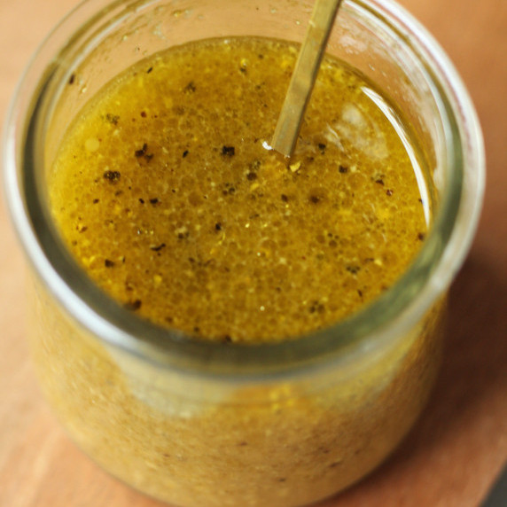 finished maple dijon vinaigrette dressing in a glass jar