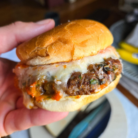 Golden buns, melty white mozzarella, juicy meatball patty and pops of red sauce.