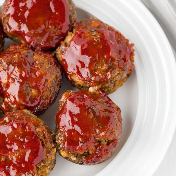 Plate of miniature meatloaves.