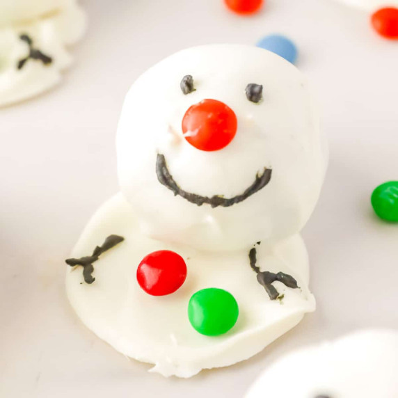 Snowman Oreo ball decorated with candy close up.