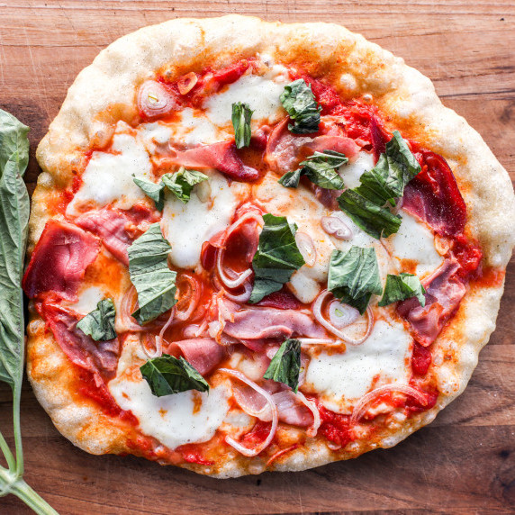 Homemade Neapolitan pizza with mozzarella cheese, and homemade garlic herb tomato sauce