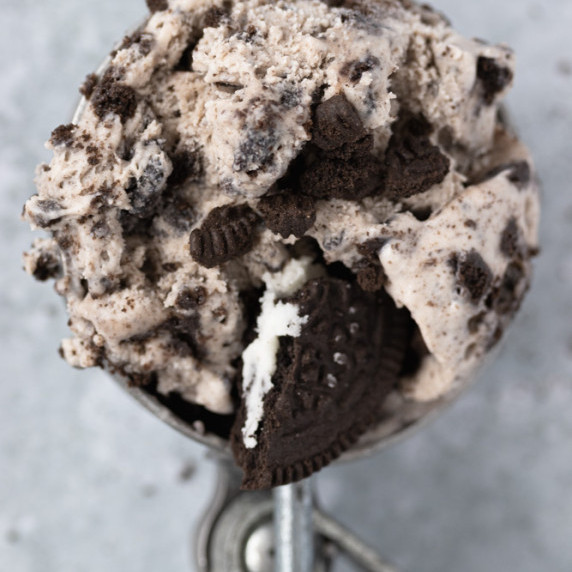 Macro shot Ice scoop with oreo ice on a grey background