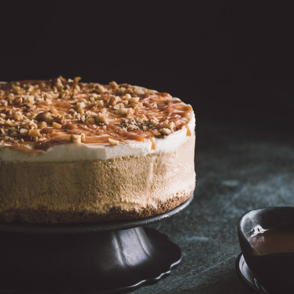 pumpkin ice cream cake on a stand