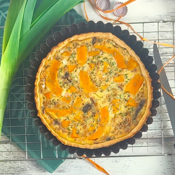 Pumpkin and Gorgonzola tart on a cooling rack 