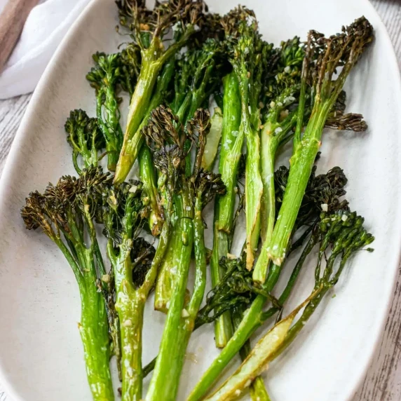 broccolini on a white dish