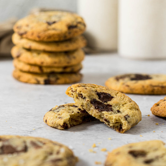 Chocolate chip cookie broken in half. 