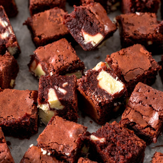 Red velvet brownie bites on parchment paper.