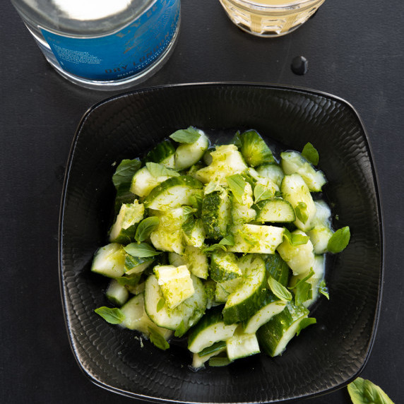 A bowl of cucumber salad.
