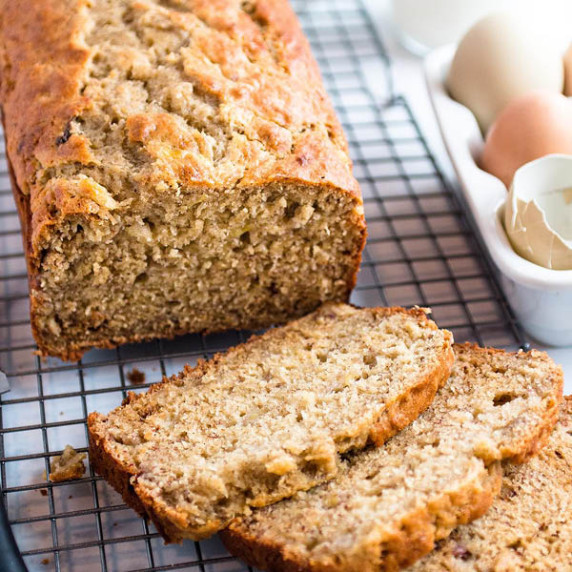 A loaf of sourdough banana bread on a cooling rack. 