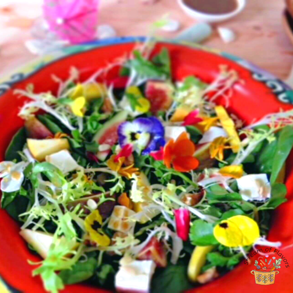 Salad with spinach, apples, feta cheese, walnuts, figs, and watercress with tamarind vinaigrette