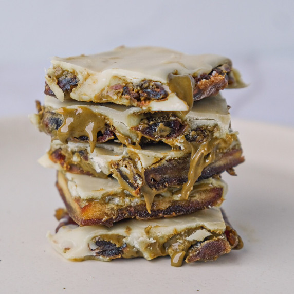 Stacked squares of white chocolate and pistachio date bark 