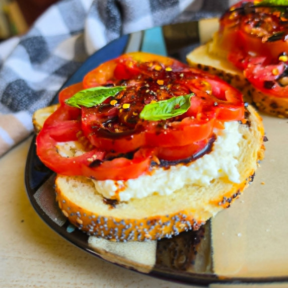 Golden bread, creamy white Stracciatella cheese, and vibrant tomatoes.