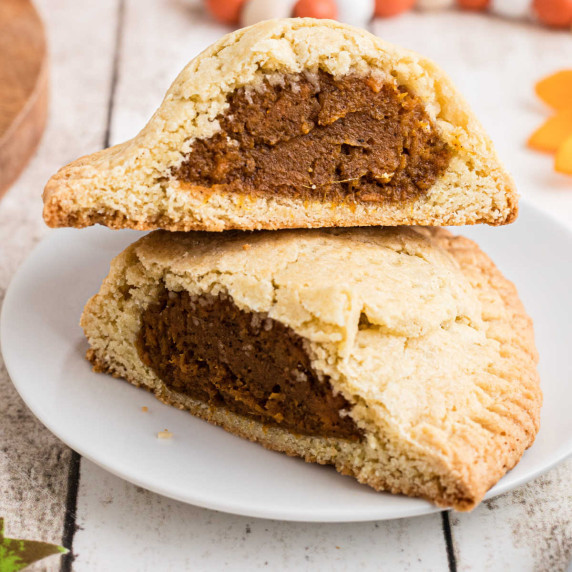 Close up of sweet potato hand pies cut in half.